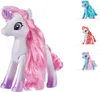 A main product image of a white unicorn toy with pink hair, shown in the center. To the right, there are three smaller inset images of other unicorn toys in different colors. Produktbild-Vorschau