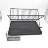 A black metal dish drying rack with a separate utensil holder, placed on a white background. Náhled obrázku produktu