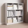 A white bookshelf filled with books and decorative boxes against a light gray wall. Podgląd zdjęcia produktu