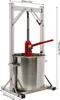 A stainless steel fruit press with a red hydraulic jack and a large metal drum. Náhled obrázku produktu