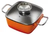 A square orange pot with a glass lid and silver handles, shown from a slightly elevated angle. Produktbild-Vorschau