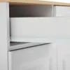 A close-up view of an open drawer in a white sideboard with a wooden top. Anteprima dell’immagine prodotto