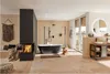 A luxurious bathroom with a freestanding bathtub, fireplace, and vanity. Anteprima dell’immagine prodotto
