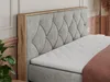 A close-up view of a bed with a tufted headboard and a wooden frame. Produktbild-Vorschau