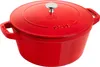 A red Staub cast iron pot with a silver knob on its lid, shown from a slightly elevated side angle against a white background. Produktbild-Vorschau