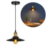 A black and gold pendant light with a vintage style, shown on a white background and also in a circular inset showing it in a room setting. Podgląd zdjęcia produktu