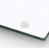 A close-up shot of a clear glass surface with a small, translucent bumper on it. Produktbild-Vorschau