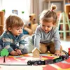 Two young children are playing with a toy train set on a colorful play mat. Produktbild-Vorschau