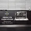 A compact dishwasher installed in a dark wood cabinet, under a tiled backsplash in a kitchen setting. Produktbild-Vorschau