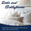 A bed with several pillows, some decorative and some for sleeping. Produktbild-Vorschau