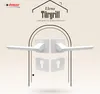 A marketing image showcasing a white door handle set with square rosettes and keyhole covers, presented within an arched graphic element. Produktbild-Vorschau
