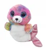 A plush toy seal with rainbow-colored fur and large blue eyes, shown against a white background. Anteprima dell’immagine prodotto