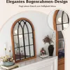 A decorative arched mirror with a wooden frame and black metal accents, displayed on a mantelpiece with decorative items. Náhľad obrázku produktu