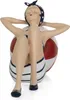 A decorative figurine of a woman in a swimsuit relaxing on a beach ball. Anteprima dell’immagine prodotto