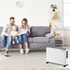 A family is sitting on a couch in a living room, reading a book. A white electric heater is placed on the floor in the foreground. Anteprima dell’immagine prodotto