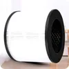 A cylindrical air filter with black rims on both ends, placed on a light-colored surface. Náhled obrázku produktu