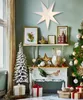 A festive Christmas scene with a decorated tree, gifts, and festive decor. Voir les images du produit