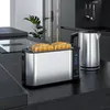 A toaster and kettle are on a kitchen counter. Produktbild-Vorschau