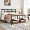 A black metal bed frame with a mattress and bedding is shown in a bedroom setting. Podgląd zdjęcia produktu