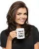 A woman holds a mug with text on it. Náhled obrázku produktu
