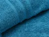 A close-up view of a teal-colored towel, showing its texture and woven stripes. Anteprima dell’immagine prodotto