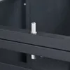 A close-up view of a metal pin mechanism on a dark gray metal structure, likely part of a trash bin enclosure. Produktbild-Vorschau