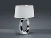 A table lamp with a silver base and a white shade is displayed against a plain gray background. Náhled obrázku produktu