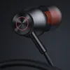 Close-up of black wired earphones with red accents. Voir les images du produit