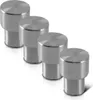 Four metal cylindrical objects with a wider top and a narrower bottom, arranged diagonally on a white background. Náhled obrázku produktu