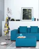 A modern living room with a blue sofa, ottoman, and a coat rack. Náhled obrázku produktu