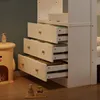 A close-up view of the drawers of a white wooden bed frame, showing storage compartments and wooden knobs. Produktbild-Vorschau
