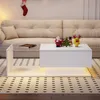A living room scene with a couch and a coffee table decorated for Christmas. Produktbild-Vorschau