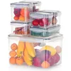 A stack of clear plastic food storage containers filled with various fruits and vegetables, arranged on a white background. Produktbild-Vorschau
