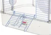 A close-up view of a blue plastic ramp attached to a clear plastic cage for a small animal. Anteprima dell’immagine prodotto