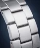 A close-up shot of a metal watch band. Podgląd zdjęcia produktu