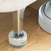 A close-up shot of a furniture leg resting on an anti-vibration foot on a wooden floor. Anteprima dell’immagine prodotto