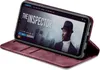 A smartphone in a burgundy flip case is displayed at an angle, showing the screen displaying a movie title. Produktbild-Vorschau