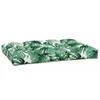 A green and white leaf-patterned cushion on a white background. Produktbild-Vorschau
