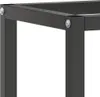 A close-up view of the corner of a black metal workbench frame, showing a bolt and nut connection. Podgląd zdjęcia produktu
