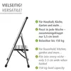 A silver and gray step stool is shown with text describing its features in German and English. Náhled obrázku produktu
