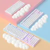 Three white keyboards are arranged on colored platforms, with white cloud-shaped wrist rests placed next to them. Podgląd zdjęcia produktu