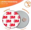 Product image showing two circular discs, one with adhesive backing and the other with a magnetic surface, with text labels indicating their function. Produktbild-Vorschau
