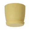 A yellow ceramic plant pot with a saucer, isolated on a white background. Náhled obrázku produktu