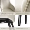 A collage of four close-up images of a cream-colored chair with black legs, highlighting its features. Produktbild-Vorschau
