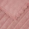 A close-up view of a pink fleece blanket with a ribbed texture and fringed edges. Náhľad obrázku produktu
