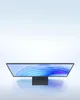 A top-down view of a computer monitor on a reflective surface with a gradient background. Podgląd zdjęcia produktu
