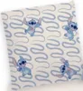 A close-up view of a pillowcase with a repeating pattern of cartoon characters. Produktbild-Vorschau