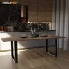A modern kitchen with a dining table in the foreground. Podgląd zdjęcia produktu