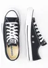 A pair of black Converse All Star sneakers are shown from a top-down perspective against a white background. Voir les images du produit