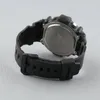 The back of a black digital watch with a black strap is shown against a light gray background. Náhled obrázku produktu